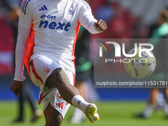 Ola Aina of Nottingham Forest warms up ahead of kick-off during the Premier League match between Nottingham Forest and Wolverhampton Wandere...