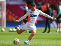 Neco Williams of Nottingham Forest warms up ahead of kick-off during the Premier League match between Nottingham Forest and Wolverhampton Wa...