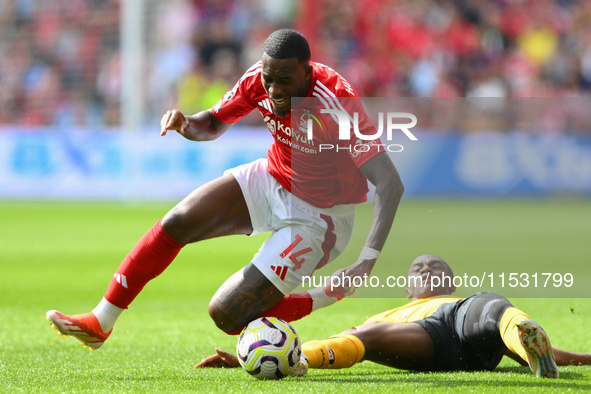 Jean-Ricner Bellegarde of Wolverhampton Wanderers fouls Callum Hudson-Odoi of Nottingham Forest during the Premier League match between Nott...