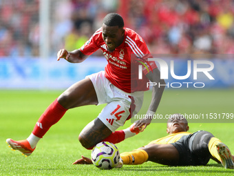 Jean-Ricner Bellegarde of Wolverhampton Wanderers fouls Callum Hudson-Odoi of Nottingham Forest during the Premier League match between Nott...