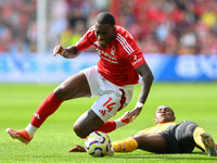 Jean-Ricner Bellegarde of Wolverhampton Wanderers fouls Callum Hudson-Odoi of Nottingham Forest during the Premier League match between Nott...