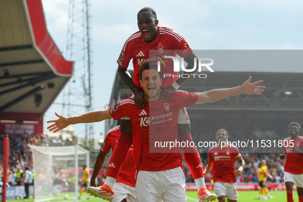 Chris Wood of Nottingham Forest celebrates with Callum Hudson-Odoi of Nottingham Forest after scoring a goal to make it 1-0 during the Premi...