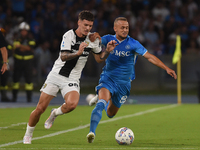 Dennis Man of Parma Calcio competes for the ball with Stanislav Lobotka of SSC Napoli during the Serie A match between SSC Napoli and Parma...