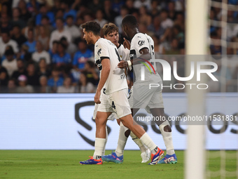 Ange-Yoan Bonny of Parma Calcio celebrates with team mates after scoring during the Serie A match between SSC Napoli and Parma Calcio at Sta...