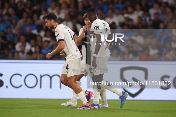 Ange-Yoan Bonny of Parma Calcio celebrates with team mates after scoring during the Serie A match between SSC Napoli and Parma Calcio at Sta...