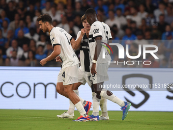 Ange-Yoan Bonny of Parma Calcio celebrates with team mates after scoring during the Serie A match between SSC Napoli and Parma Calcio at Sta...