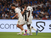 Ange-Yoan Bonny of Parma Calcio celebrates with team mates after scoring during the Serie A match between SSC Napoli and Parma Calcio at Sta...