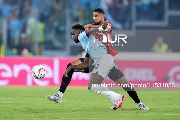 Boulaye Dia of SS Lazio and Ruben Loftus-Cheek of AC Milan compete for the ball during the Serie A Enilive match between SS Lazio and AC Mil...