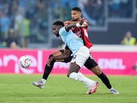 Boulaye Dia of SS Lazio and Ruben Loftus-Cheek of AC Milan compete for the ball during the Serie A Enilive match between SS Lazio and AC Mil...