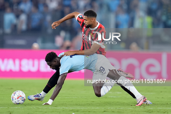 Boulaye Dia of SS Lazio and Ruben Loftus-Cheek of AC Milan compete for the ball during the Serie A Enilive match between SS Lazio and AC Mil...