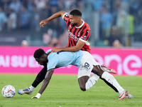 Boulaye Dia of SS Lazio and Ruben Loftus-Cheek of AC Milan compete for the ball during the Serie A Enilive match between SS Lazio and AC Mil...