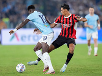 Tijjani Reijnders of AC Milan and Boulaye Dia of SS Lazio compete for the ball during the Serie A Enilive match between SS Lazio and AC Mila...