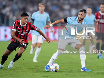 Taty Castellanos of SS Lazio and Tijjani Reijnders of AC Milan compete for the ball during the Serie A Enilive match between SS Lazio and AC...