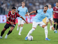 Taty Castellanos of SS Lazio and Tijjani Reijnders of AC Milan compete for the ball during the Serie A Enilive match between SS Lazio and AC...