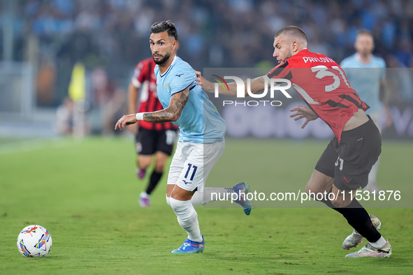 Taty Castellanos of SS Lazio and Strahinja Pavlovic of AC Milan compete for the ball during the Serie A Enilive match between SS Lazio and A...