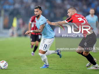 Taty Castellanos of SS Lazio and Strahinja Pavlovic of AC Milan compete for the ball during the Serie A Enilive match between SS Lazio and A...