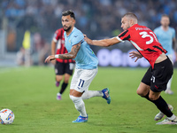 Taty Castellanos of SS Lazio and Strahinja Pavlovic of AC Milan compete for the ball during the Serie A Enilive match between SS Lazio and A...