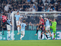 Strahinja Pavlovic of AC Milan scores first goal during the Serie A Enilive match between SS Lazio and AC Milan at Stadio Olimpico on Aug 31...