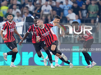 Strahinja Pavlovic of AC Milan celebrates after scoring first goal during the Serie A Enilive match between SS Lazio and AC Milan at Stadio...