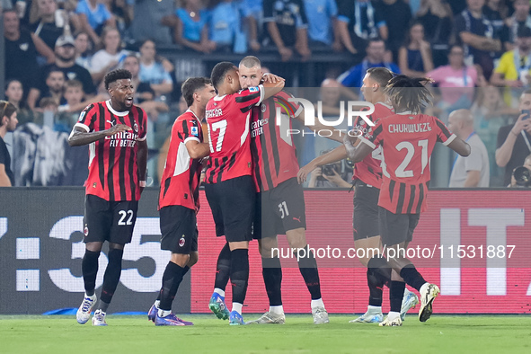 Strahinja Pavlovic of AC Milan celebrates after scoring first goal during the Serie A Enilive match between SS Lazio and AC Milan at Stadio...