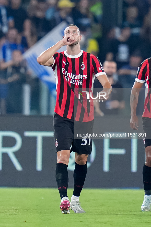 Strahinja Pavlovic of AC Milan celebrates after scoring first goal during the Serie A Enilive match between SS Lazio and AC Milan at Stadio...