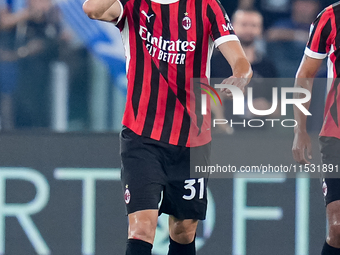 Strahinja Pavlovic of AC Milan celebrates after scoring first goal during the Serie A Enilive match between SS Lazio and AC Milan at Stadio...