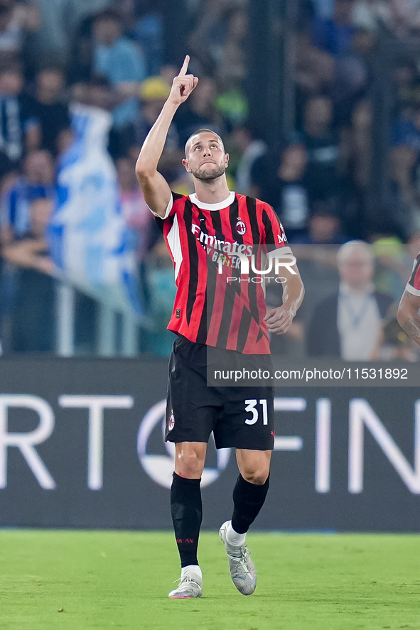 Strahinja Pavlovic of AC Milan celebrates after scoring first goal during the Serie A Enilive match between SS Lazio and AC Milan at Stadio...