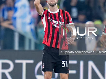 Strahinja Pavlovic of AC Milan celebrates after scoring first goal during the Serie A Enilive match between SS Lazio and AC Milan at Stadio...