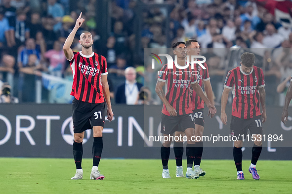 Strahinja Pavlovic of AC Milan celebrates after scoring first goal during the Serie A Enilive match between SS Lazio and AC Milan at Stadio...