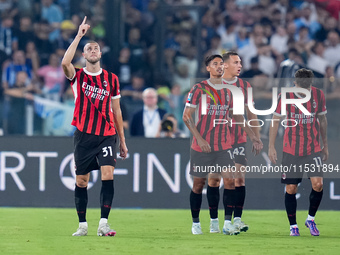 Strahinja Pavlovic of AC Milan celebrates after scoring first goal during the Serie A Enilive match between SS Lazio and AC Milan at Stadio...