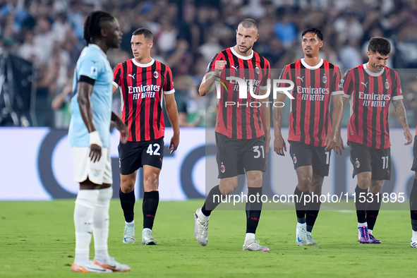 Strahinja Pavlovic of AC Milan celebrates after scoring first goal during the Serie A Enilive match between SS Lazio and AC Milan at Stadio...