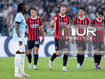 Strahinja Pavlovic of AC Milan celebrates after scoring first goal during the Serie A Enilive match between SS Lazio and AC Milan at Stadio...