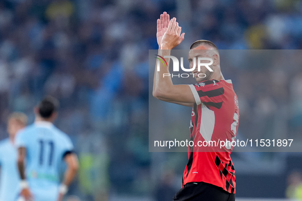 Strahinja Pavlovic of AC Milan celebrates after scoring first goal during the Serie A Enilive match between SS Lazio and AC Milan at Stadio...