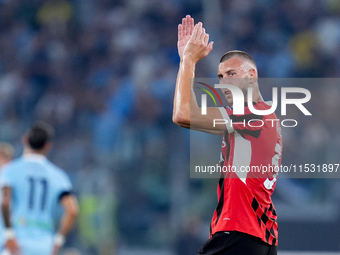 Strahinja Pavlovic of AC Milan celebrates after scoring first goal during the Serie A Enilive match between SS Lazio and AC Milan at Stadio...