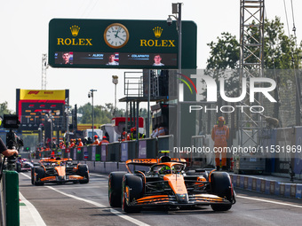 Lando Norris of McLaren and Oscar Piastri of McLaren drive cars during the qualifying session ahead of the Italian Formula One Grand Prix at...