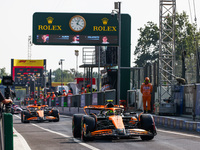 Lando Norris of McLaren and Oscar Piastri of McLaren drive cars during the qualifying session ahead of the Italian Formula One Grand Prix at...