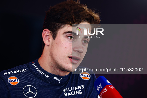 Franco Colapinto of Williams talks to media after the qualifying session ahead of the Italian Formula One Grand Prix at Autodromo Nazionale...