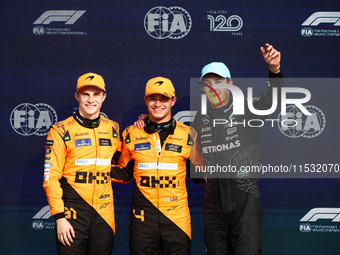 Oscar Piastri of McLaren, Lando Norris of McLaren and George Russell of Mercedes pose after qualifying session ahead of the Italian Formula...