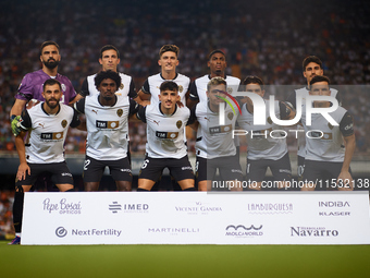 Valencia CF players pose for a team photo prior to the LaLiga EA Sports match between Valencia CF and Villarreal CF at Mestalla stadium in V...