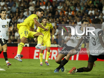 Villarreal's Ayoze Perez Gutierrez scores the 1-1 goal during the La Liga match between Valencia CF and Villarreal CF at Mestalla Stadium in...