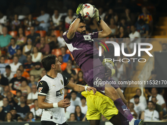 Giorgi Mamardashvili of Valencia CF jumps for the ball during the La Liga match between Valencia CF and Villarreal CF at Mestalla Stadium in...