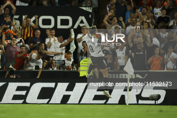 Hugo Duro of Valencia CF celebrates after scoring the 1-0 goal during the La Liga match between Valencia CF and Villarreal CF at Mestalla St...