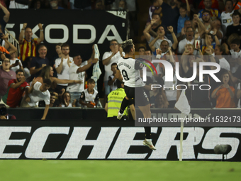 Hugo Duro of Valencia CF celebrates after scoring the 1-0 goal during the La Liga match between Valencia CF and Villarreal CF at Mestalla St...