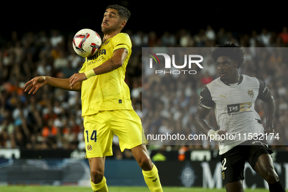 Villarreal's Santi Comesana (left) and Thierry Correia of Valencia CF during the La Liga match between Valencia CF and Villarreal CF at Mest...