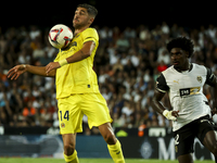 Villarreal's Santi Comesana (left) and Thierry Correia of Valencia CF during the La Liga match between Valencia CF and Villarreal CF at Mest...