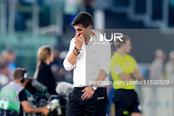 Paulo Fonseca head coach of AC Milan looks dejected during the Serie A Enilive match between SS Lazio and AC Milan at Stadio Olimpico on Aug...