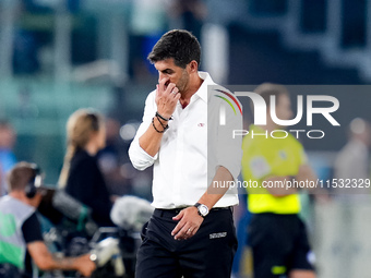 Paulo Fonseca head coach of AC Milan looks dejected during the Serie A Enilive match between SS Lazio and AC Milan at Stadio Olimpico on Aug...