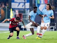 Christian Pulisic of AC Milan and Boulaye Dia of SS Lazio compete for the ball during the Serie A Enilive match between SS Lazio and AC Mila...