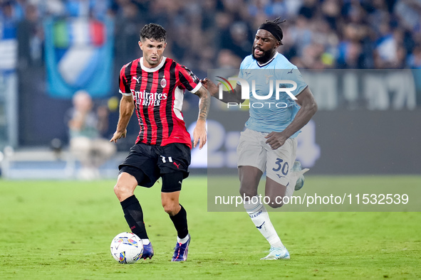 Christian Pulisic of AC Milan and Nuno Tavares of SS Lazio compete for the ball during the Serie A Enilive match between SS Lazio and AC Mil...