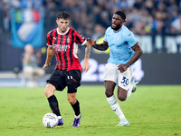 Christian Pulisic of AC Milan and Nuno Tavares of SS Lazio compete for the ball during the Serie A Enilive match between SS Lazio and AC Mil...